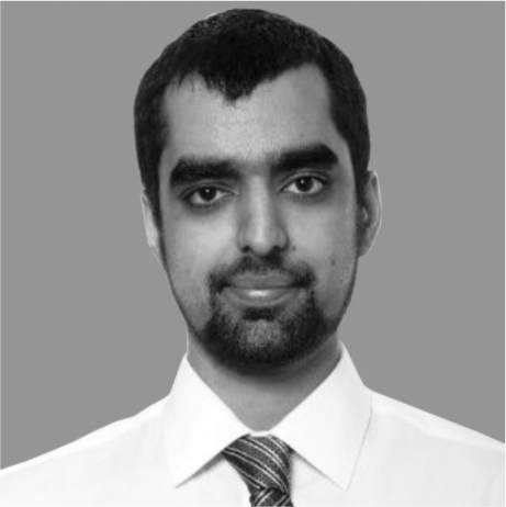 Headshot of Co-Founder Adam in greyscale