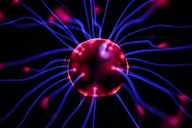 Image of a plasma ball with electricity firing out from it